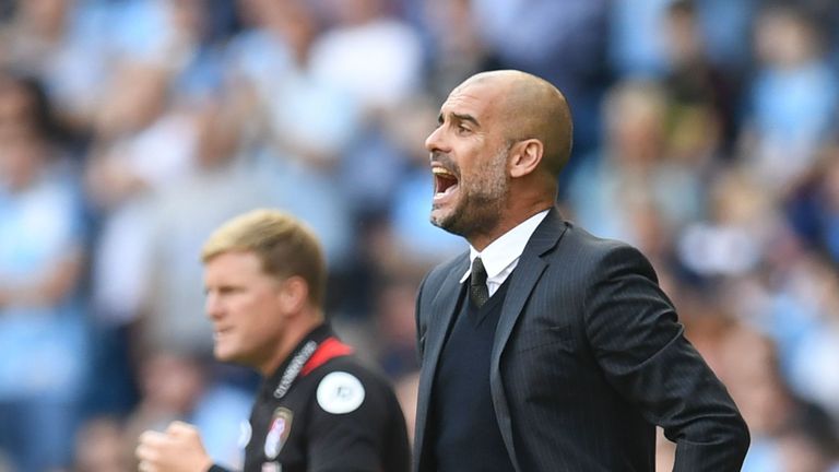 Manchester City's Spanish manager Pep Guardiola (R) gestures on the touchline next to Bournemouth's English manager Eddie Howe (L) during the English Premier League football match between Manchester City and Bournemouth at the Etihad Stadium in Manchester, north west England, on September 17, 2016.