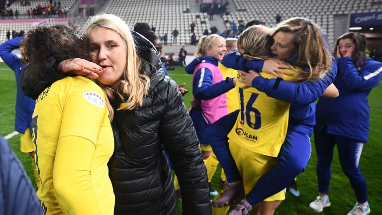 Emma Hayes congratulates her Chelsea players after beating Paris Saint-Germain on aggregate