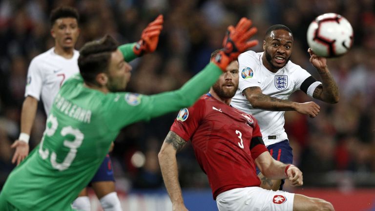 England's midfielder Raheem Sterling (R) watches as his shot beats Czech Republic's goalkeeper Jiri Pavlenka for England's third goal during the UEFA Euro 2020 Group A qualification football match between England and Czech Replublic at Wembley Stadium in London on March 22, 2019