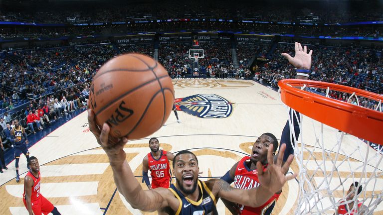 Derrick Favors of the Utah Jazz drives to the basket during the game against the New Orleans Pelicans 
