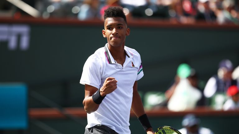 Felix Auger-Aliassime of Canada celebrates match point against Stefanos Tsitsipas of Greece during their men's singles second round match on day six of the BNP Paribas Open at the Indian Wells Tennis Garden on March 09, 2019 in Indian Wells, California.