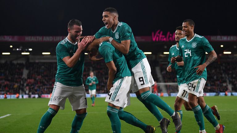 Felix Uduokhai of Germany is swamped by team mates after scoring the wnning goal during an England U21 v Germany U21 International Friendly at Vitality Stadium on March 26, 2019 in Bournemouth, England.