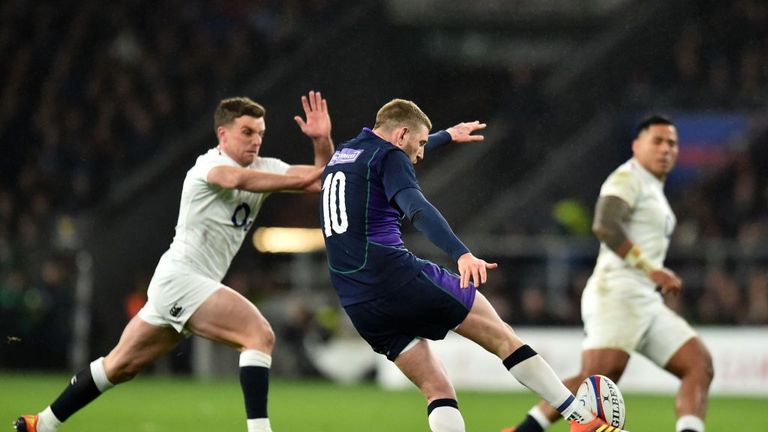 Finn Russell putting boot to ball in the second-half against England