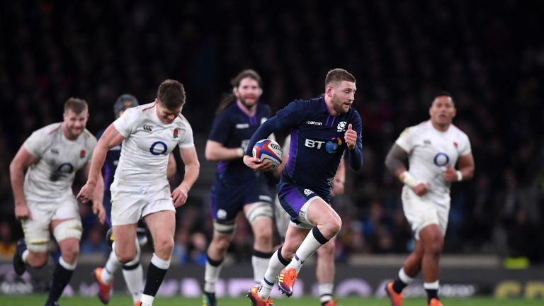 Finn Russell of Scotland breaks away for a try after intercepting an Owen Farrell pass during the Guinness Six Nations match between England and Scotland at Twickenham Stadium on March 16, 2019 in London, England.
