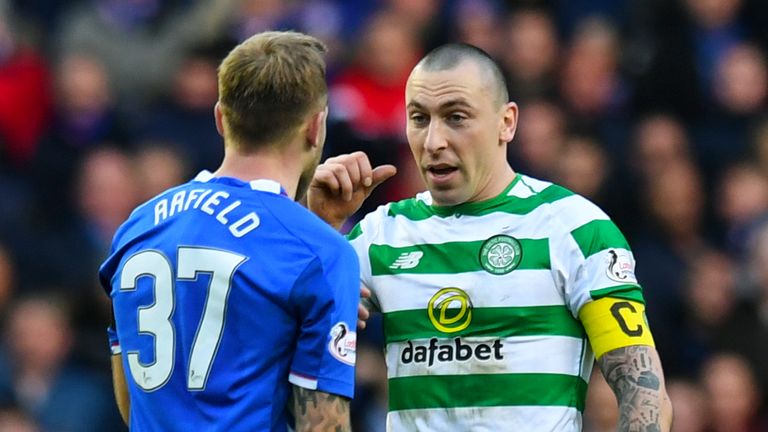 Celtic captain Scott Brown exchanges words with Rangers' Scott Arfield