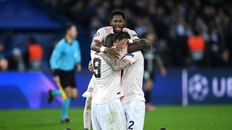 Fred embraces Romelu Lukaku and Victor Lindelof