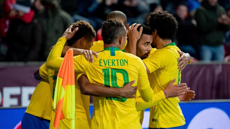 Gabriel Jesus is mobbed by team-mates after scoring against Czech Republic