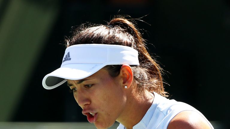 Garbine Muguruza of Spain celebrates match point against Kiki Bertens of the Netherlands during their women's singles fourth round match on day nine of the BNP Paribas Open at the Indian Wells Tennis Garden on March 12, 2019 in Indian Wells, California.