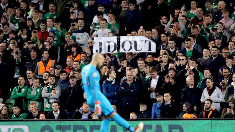 Darren Randolph kicks tennis balls off the pitch during the game against Republic of Ireland