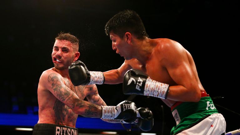 German Benitez lands a right on Lewis Ritson during their super lightweight clash