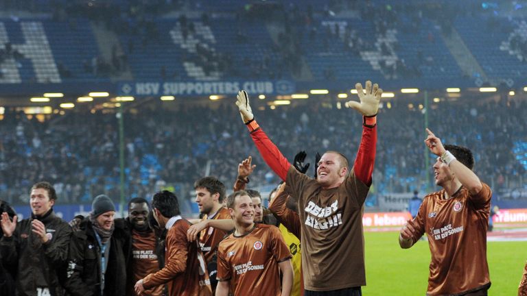 St Pauli celebrate victory over Hamburg at Imtech Arena on February 16, 2011 in Hamburg, Germany.