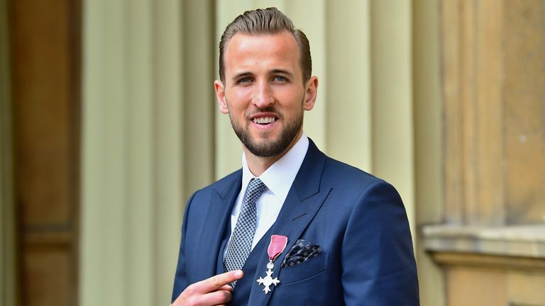 Harry Kane poses for a photo after receiving his MBE from Prince William, Duke of Cambridge during an Investiture ceremony at Buckingham Palace