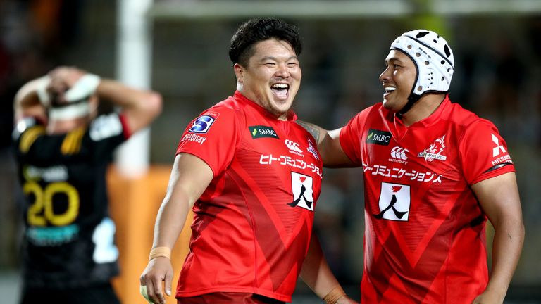 Hiroshi Yamashita (L) celebrates with Asaeli Ai Valu after the Sunwolves beat the Chiefs