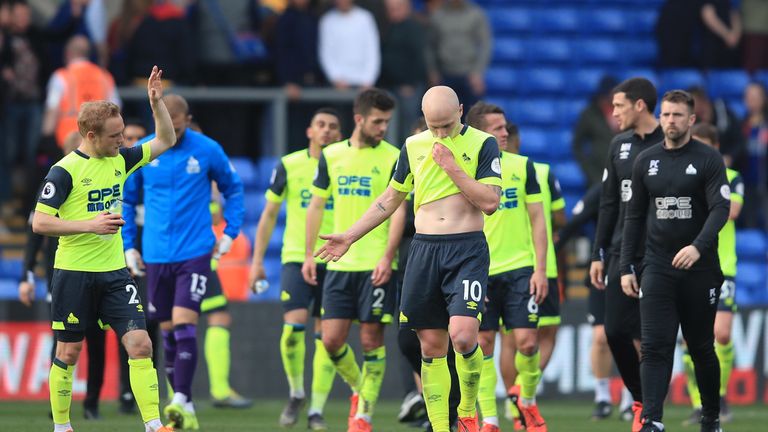 Huddersfield Town players look dejected following a 2-0 defeat to Crystal Palace. One of three results that confirmed the club&#39;s relegation from the Premier League