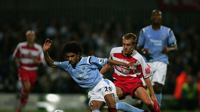 DONCASTER, ENGLAND - SEPTEMBER 21: Yasser Hussein of Man City shields the ball from James Coppinger of Doncaster during the Carling Cup Round Two match between Doncaster Rovers and Manchester City at Belle Vue on September 21, 2005 in Doncaster, England   (Photo by Michael Steele/Getty Images) *** Local Caption *** Yasser Hussein;James Coppinger