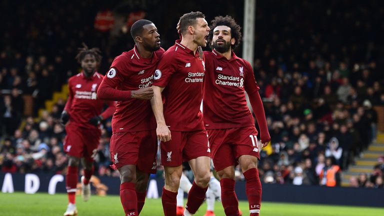 Liverpool's English midfielder James Milner (C) celebrates scoring the team's second goal during the English Premier League football match between Fulham and Liverpool at Craven Cottage in London on March 17, 2019.