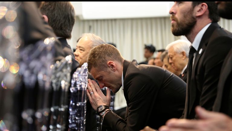 Leicester City striker Jamie Vardy bows his head in prayer as the team pay their respects ahead of late chairman Vichai Srivaddhanaprabha's cremation