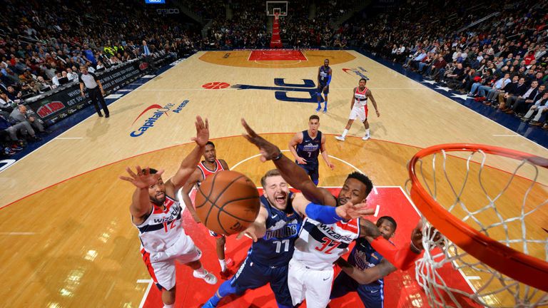 Jeff Green of the Washington Wizards blocks a shot against Luka Doncic of the Dallas Mavericks
