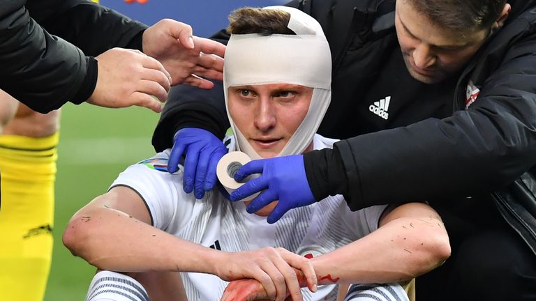 Georgia&#39;s defender Jemal Tabidze receives medical help during the Euro 2020 football qualification match between Georgia and Switzerland in Tbilisi on March 23, 2019.