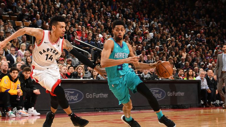 Charlotte Hornets # 3 Jeremy Lamb takes the lead in the game against Danny Green, No. 14 of the Toronto Raptors, on March 24, 2019, at the Scotiabank Arena in Toronto, Ontario, Canada.