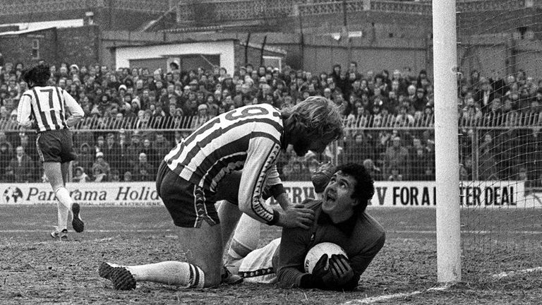 John Burridge's expression says it all as Brighton's Teddy Maybank has a word in a 1979 match