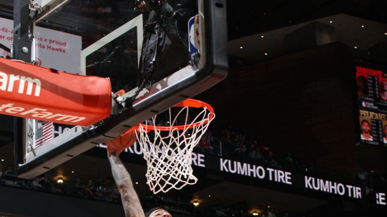 John Collins of the Atlanta Hawks drives to the basket during the game against the New Orleans Pelicans
