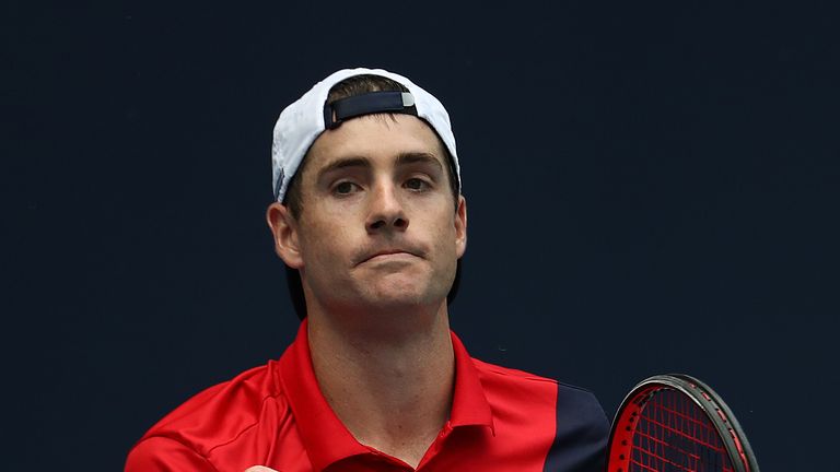 John Isner celebrates match point against Felix Auger Aliassime of Canada during day 12 of the Miami Open presented by Itau at Hard Rock Stadium on March 29, 2019 in Miami Gardens, Florida. 