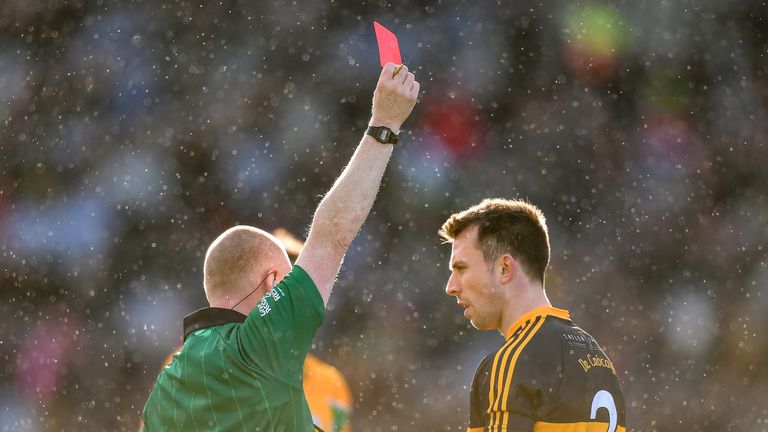 John Payne is sent off by referee Barry Cassidy