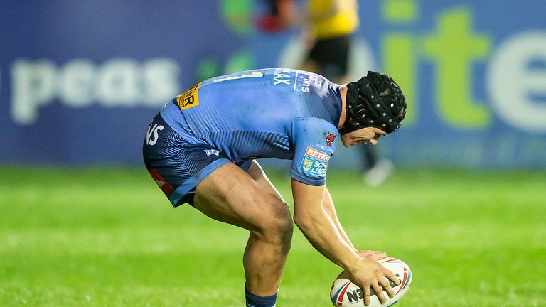 St Helens' Jonny Lomax touches down for a try against Castleford