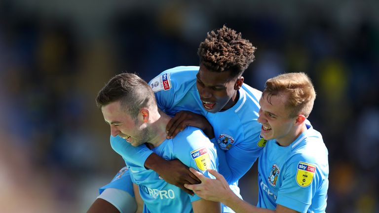 Jordan Shipley of Coventry City celebrates his goal with Dujon Sterling and Jordan Thompson of Coventry City during the Sky Bet League One match between Oxford United and Coventry City at Kassam Stadium on September 9, 2018 in Oxford, United Kingdom