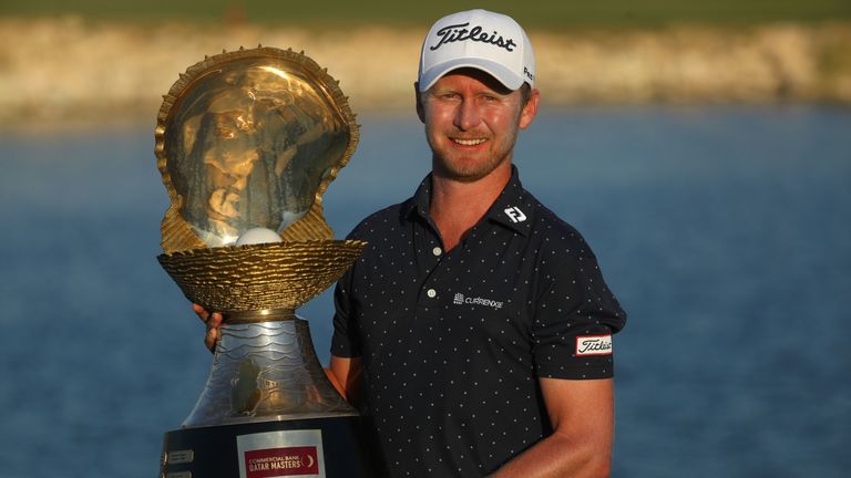 Justin Harding proudly displays the Qatar Masters trophy