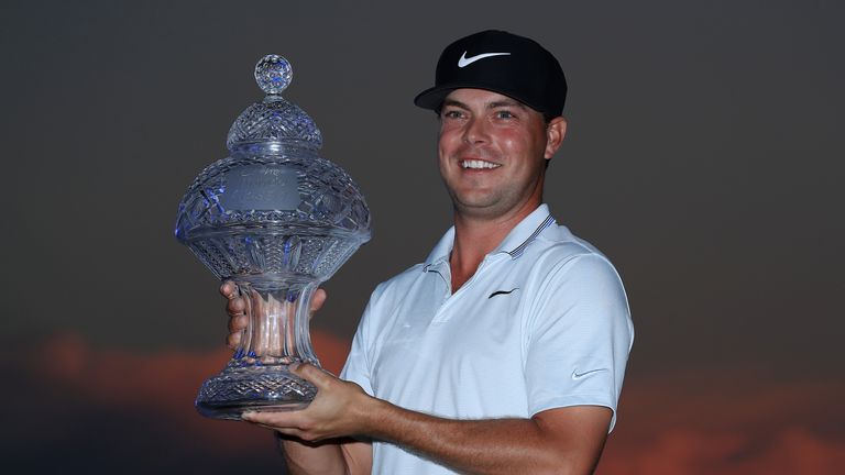 Keith Mitchell proudly displays the Honda Classic trophy