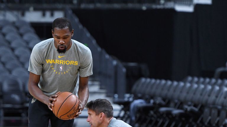 Kevin Durant (L) #35 of the Golden State Warriors works with Dr. Rick Celebrini, director of sports medicine and performance for the Warriors, during a shootaround ahead of the team's preseason game against the Los Angeles Lakers at T-Mobile Arena on October 10, 2018 in Las Vegas, Nevada