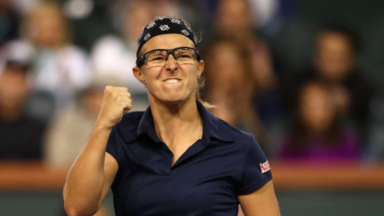 Kirsten Flipkens of Belgium celebrates her three set victory against Eugenie Bouchard of Canada during their women's singles first round match on day four of the BNP Paribas Open at the Indian Wells Tennis Garden on March 07, 2019 in Indian Wells, California