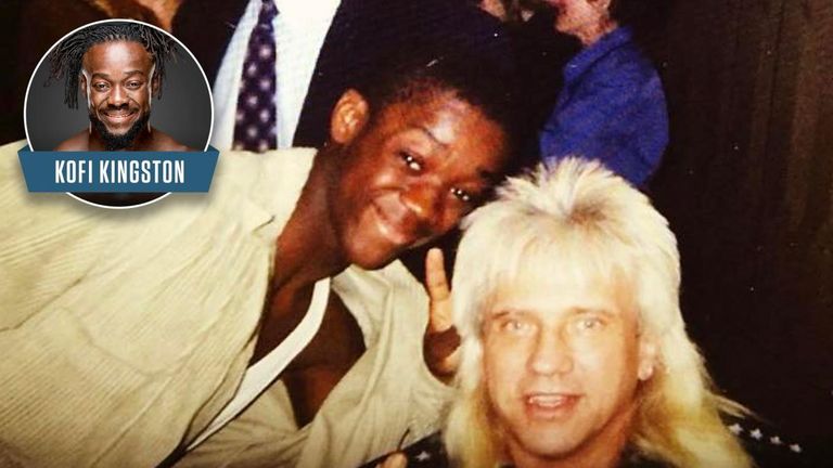 Kofi Kingston smiles for the camera as he bags a fan picture with Rock n Roll Express tag-team legend Ricky Morton