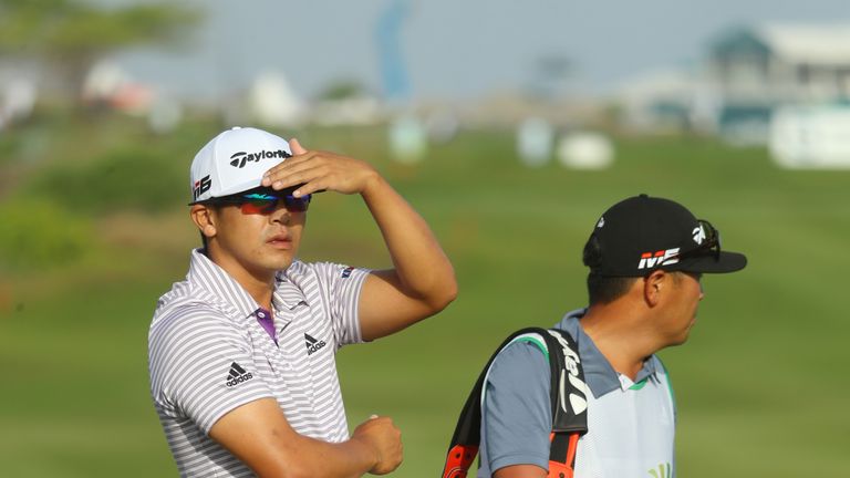 Kurt Kitayama of the United States and caddie look on from the 12th hole during day two of the Oman Open at Al Mouj Golf Complex on March 01, 2019 in Muscat, Oman. 
