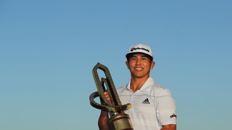 Kurt Kitayama of USA holds the winner's trophy after winning the Oman Golf Classic at Al Mouj Golf on March 03, 2019 in Muscat, Oman