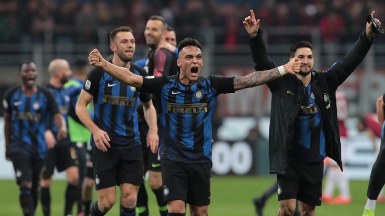 Lautaro Martinez celebrates Inter Milan's win over local rivals AC Milan with his team-mates.