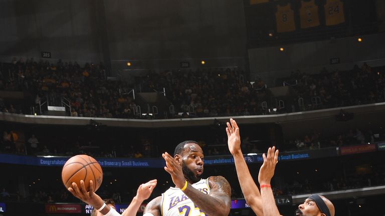 LeBron James #23 of the Los Angeles Lakers looks to pass the ball during the game against Corey Brewer #33 of the Sacramento Kings on March 24, 2019 at STAPLES Center in Los Angeles, California.