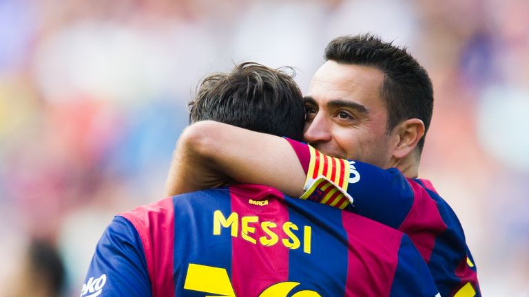 Lionel Messi and Xavi celebrate whilst playing alongside each other at Barcelona.