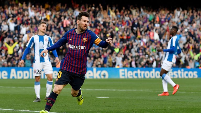 Lionel Messi celebrates scoring his side's second against Espanyol