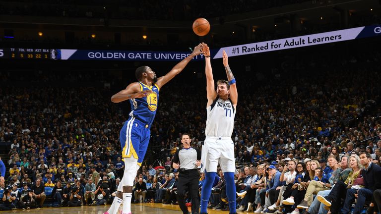 Luka Doncic #77 of the Dallas Mavericks shoots three point basket against the Golden State Warriors on March 23, 2019 at ORACLE Arena in Oakland, California.