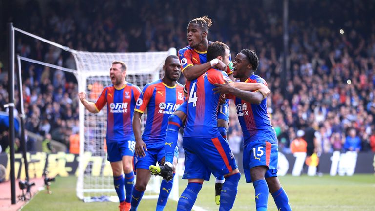 Luka Milivojevic is mobbed by team-mates after giving Crystal Palace the lead