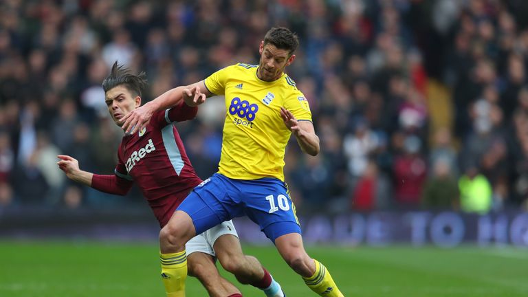 Lukas Jutkiewicz of Birmingham City tackles Jack Grealish of Aston Villa during the Sky Bet Championship match between Aston Villa and Birmingham City at Villa Park on November 25, 2018 in Birmingham, England. 