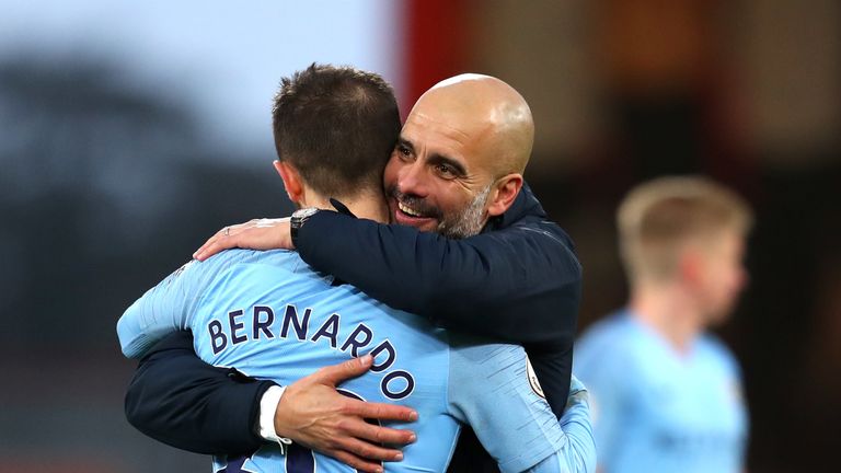 Josep Guardiola, Manager of Manchester City embraces Bernardo Silva of Manchester City following the Premier League match between AFC Bournemouth and Manchester City