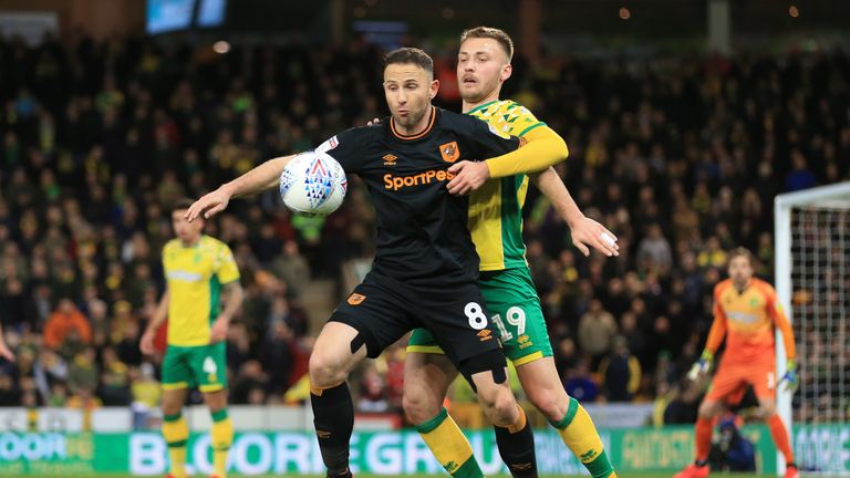 Hull's Marc Pugh in action with Tom Trybull of Norwich 