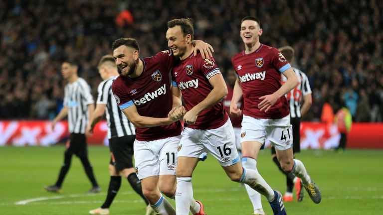 Mark Noble celebrates with Robert Snodgrass after scoring of West Ham's second goal 