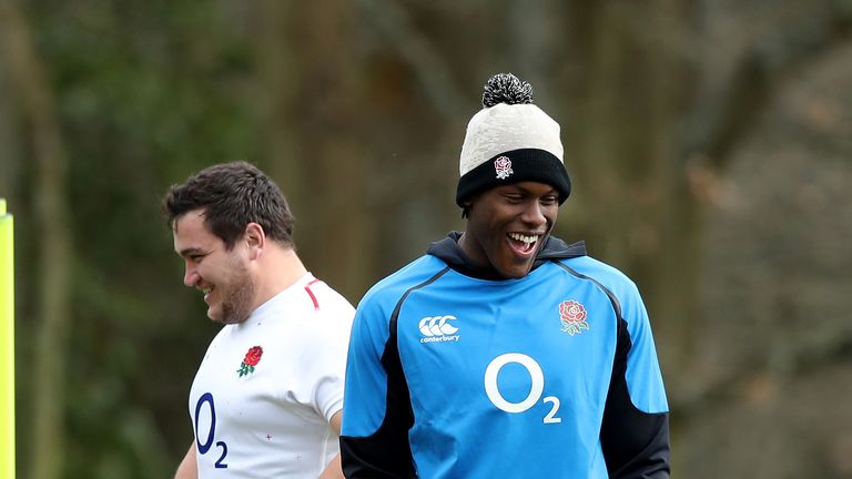 Maro Itoje, (R) who will miss the match against Italy through injury,, looks on with team team Jamie George during the England captain's run at Pennyhill Park on March 08, 2019 in Bagshot, England