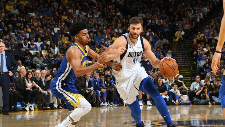 The Golden State Warriors' Nemanja Bjelica (8) guards against the Dallas  Mavericks' Luka Doncic (77) in the fourth quarter of Game 4 of their NBA  Western Conference finals playoff game at the