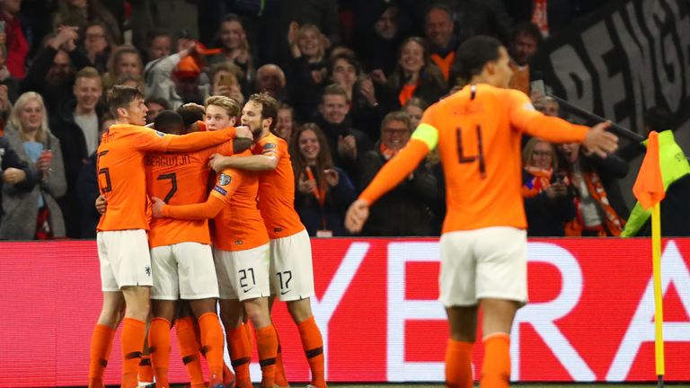 Memphis Depay of the Netherlands (obscured) celebrates after scoring his team's second goal with team-mates during the 2020 UEFA European Championships Group C qualifying match between Netherlands and Germany at Johan Cruyff Arena on March 24, 2019 in Amsterdam, Netherlands